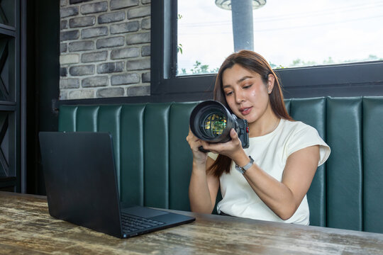 Female content creator adjusting camera settings before photo shoot