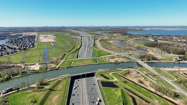 Road aqueduct above a major highway with traffic in Europe