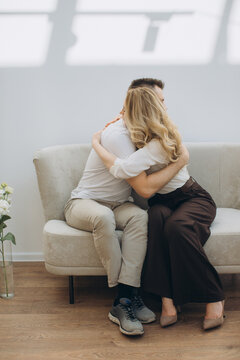 Couple embracing therapist while receiving mental health support