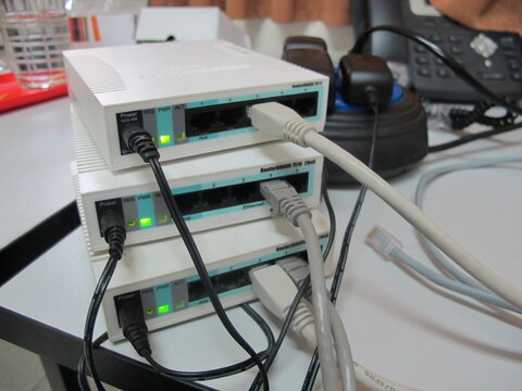 A collection of routers connected to an internet network used for technology and data communications in an office or network environment.