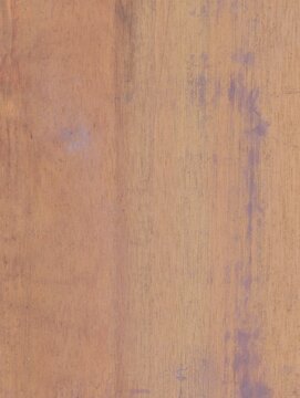 Close-up of a natural wood surface with subtle grain patterns and warm brown tones, ideal for backgrounds, design projects, and interior material textures.