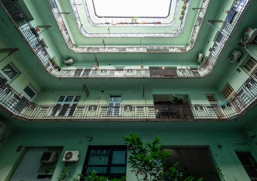 Looking skyward in the courtyard of an Art Nouveau building in Budapest's Jewish Quarter, Hungary. Elegant historic architectural detail in the style of the Hungarian Secessionist  movement. 