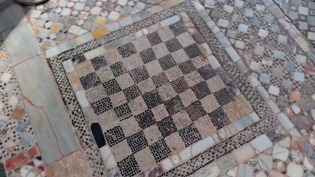 Overhead Mosaic Chessboard Floor With Geometric Stone Pattern