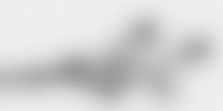 Abstract grey grainy texture background with soft light diffusion and subtle monochromatic clouds for minimalistic design layout.
