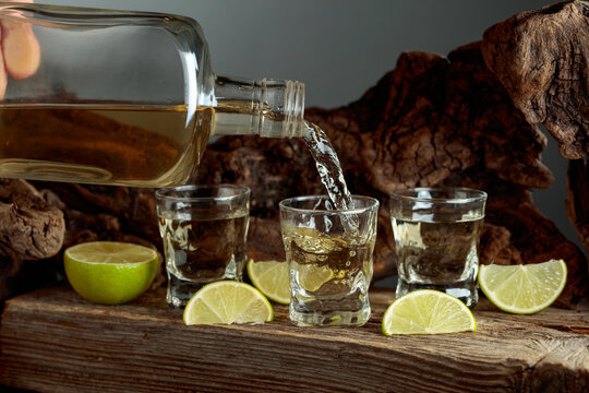 Tequila with salt and lime slices.