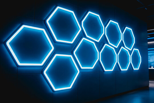 Bright blue glowing hexagonal light installations mounted on a dark modern interior wall, creating a futuristic decorative feature.