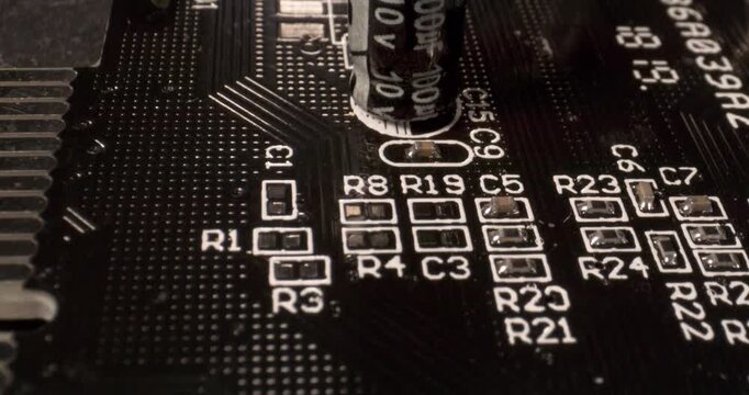 Close-up of black printed circuit board with metallic edge connector