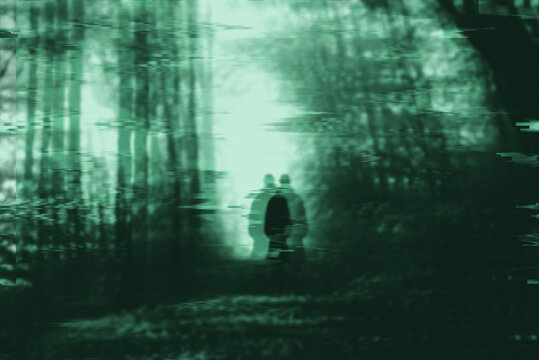 Horror forest with shadow silhouette with old analogue CRT effect and VHS glitch