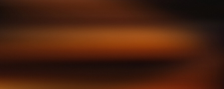 Blurred orange and brown gradient background soft focus abstract photographic texture blur color composition contrast