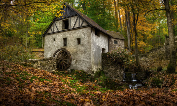 Historic Stone Water Mill Ruins Surrounded by Autumn Forest in Czech Republic