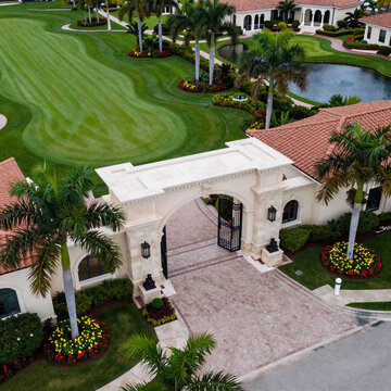 Dark Fantasy Golf Florida. Bird'S-Eye View Of A Charming Florida Golf Community Entrance