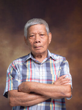 Senior Man Standing with Arms Crossed for Healthy Aging