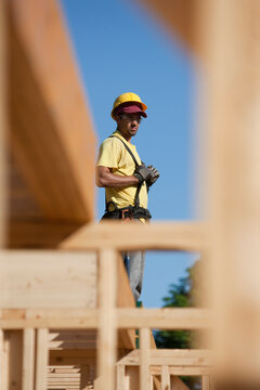 Carpenter standing on roof frame