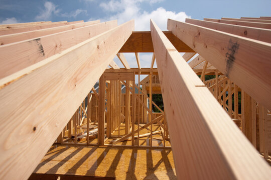 Low angle view of roof rafters of a house