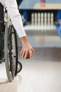 Man with a Spinal Cord Injury playing ten pin bowling