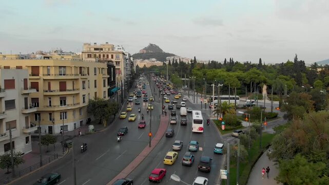 Aerial drone video of  Plaka district, Lycabettus Hill, Vasilissis Amalias Avenue in Athens, near Acropolis and Parthenon Acropolis hill, Plaka picturesque district below, Athens historic centre, Atti