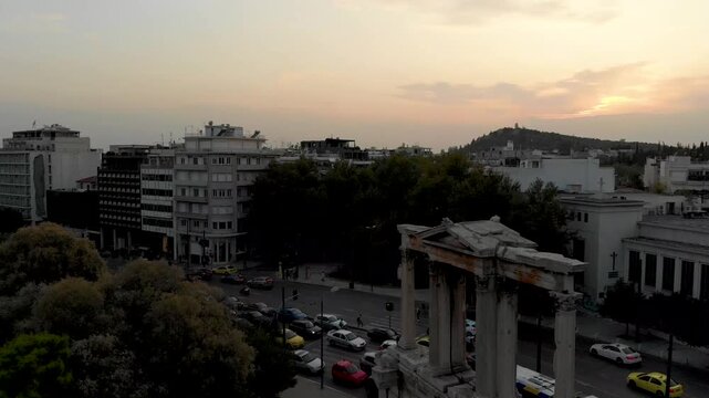 Aerial drone video of Hadrian&rsquo;s Arch in Athens, near Acropolis and Parthenon Acropolis hill, Plaka picturesque district below, Athens historic centre, Attica, Greece