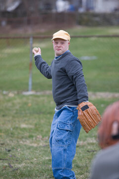 Man with Down Syndrome playing baseball