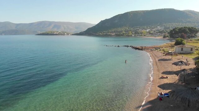 Aerial view of Beach Paralia Kechrion near Corinth Canal, Greece. Drone view from above. Summer holidays destination

