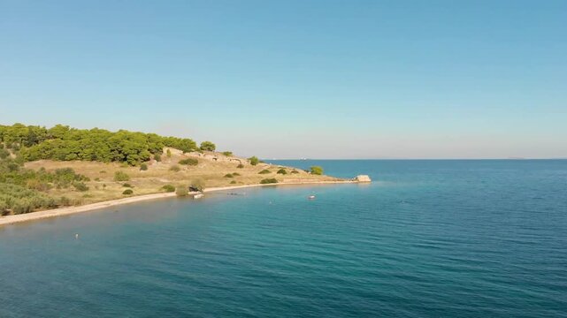 Aerial view of Beach Paralia Kechrion near Corinth Canal, Greece. Drone view from above. Summer holidays destination
