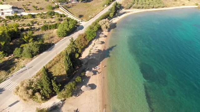 Aerial view of Beach Paralia Kechrion near Corinth Canal, Greece. Drone view from above. Summer holidays destination

