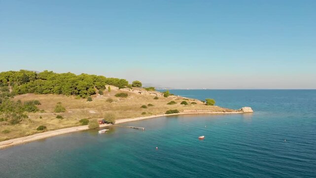 Aerial view of Beach Paralia Kechrion near Corinth Canal, Greece. Drone view from above. Summer holidays destination
