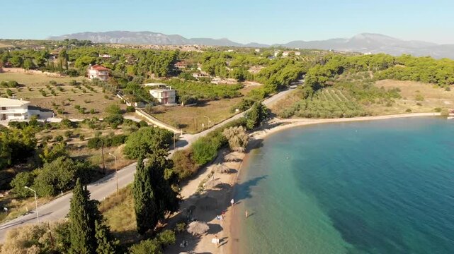 Aerial view of Beach Paralia Kechrion near Corinth Canal, Greece. Drone view from above. Summer holidays destination
