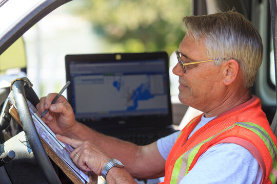 Construction supervisor logging work from truck