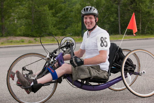 Man with spinal cord injury participating in a handcycle race