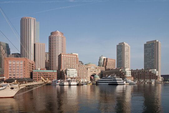 Boats with financial district on a harbor, Rowes Wharf