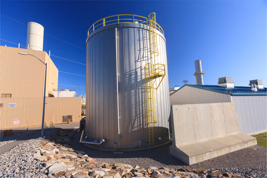 Fuel tank and exhaust stacks at an electric cogeneration plant