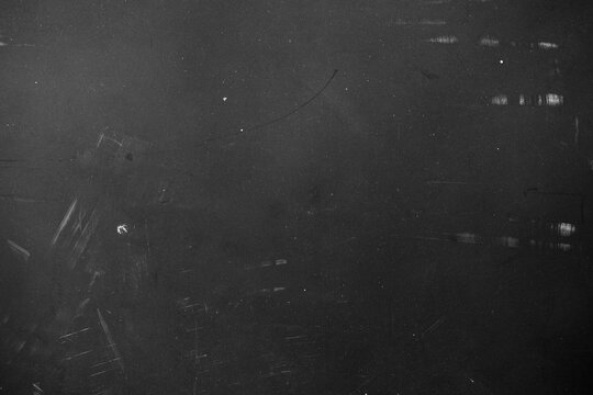 grunge overlay effect with scratch and dust on black background,retro noisy grain dust texture for film or photo overlay,old photo overlay texture,black grainy background with dust and scratch