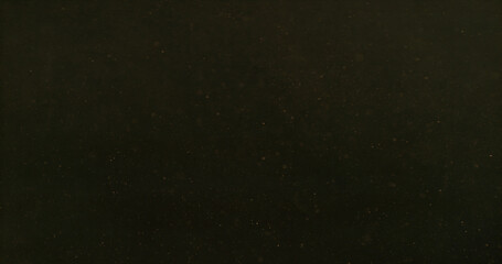 Fototapeta premium Golden dust particles suspended in the air forming an atmospheric cloud. Cinematic abstract texture perfect for overlays, visual effects, motion graphics and creative compositing projects.