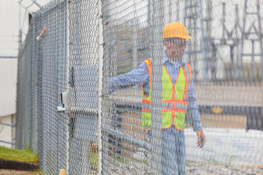 Electrical engineer using security system to enter electrical power plant