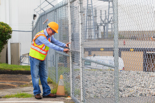 Electrical engineer using security system to enter electrical power plant