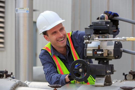 Industrial engineer working on a hydraulic pump at a power plant