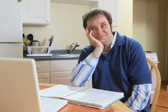 Technology engineer and programmer with Asperger's working on his computer from home