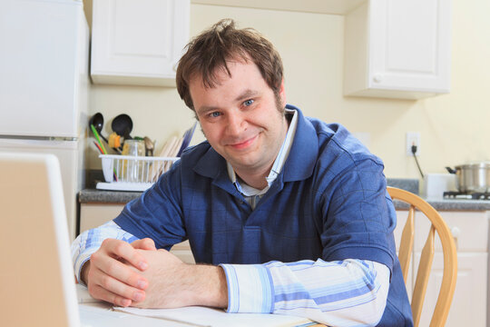 Technology engineer and programmer with Asperger's smiling