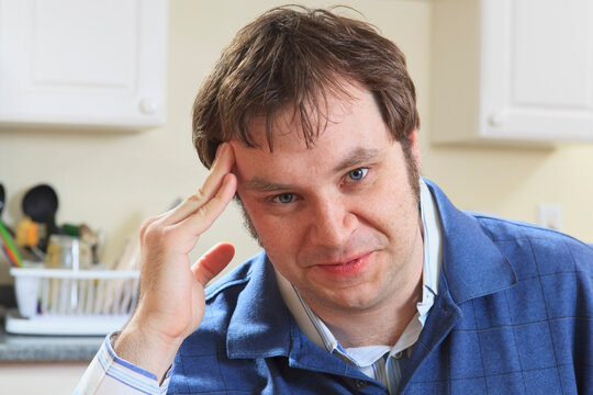 Portrait of a man with Asperger's in his home living independently