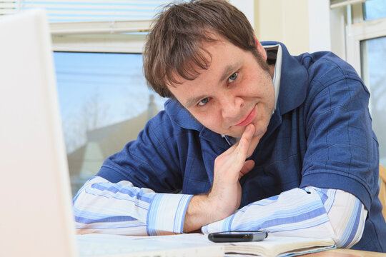 Technology engineer and programmer with Asperger's working on his computer from home