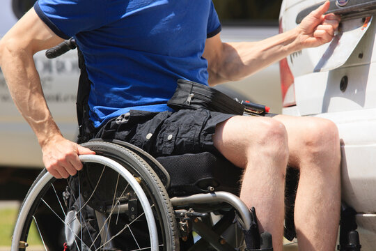 Man with spinal cord injury accessing the back of his car