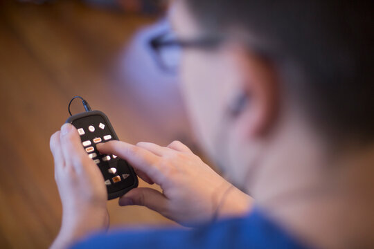 Man with Visual Impairment using his technology to communicate