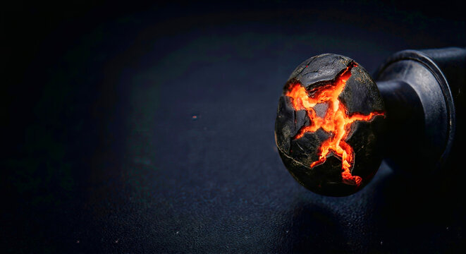 Cracked Gaming Controller Thumbstick Revealing Glowing Orange Magma on Black Surface