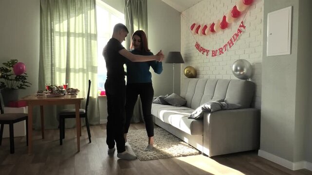 Mother teaches her son to dance