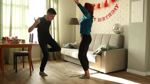 Mother and son dancing a fast dance