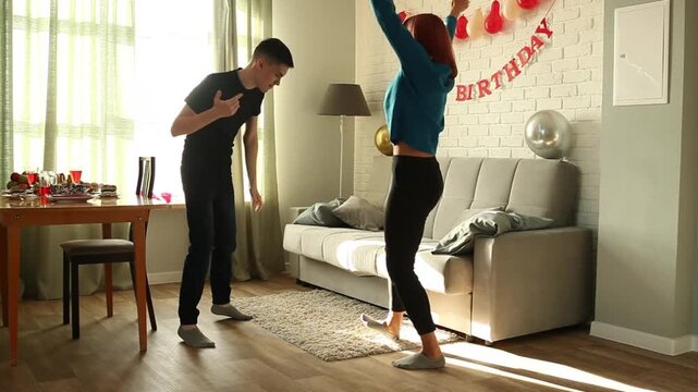 Mother and son dancing a fast dance