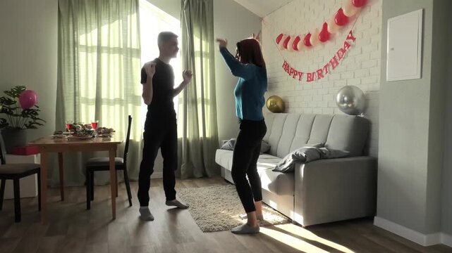 Mother and son dancing a fast dance