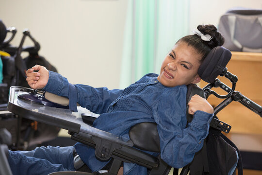 Teen with Spastic Dystonic Cerebral Palsy at school