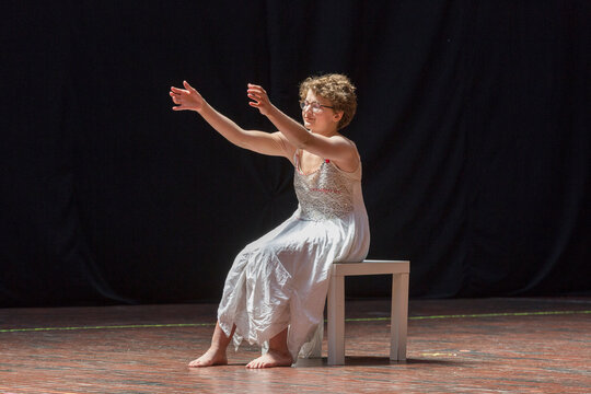 Woman with Sjogren-Larsson Syndrome performing on stage