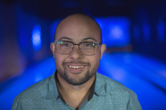 Man with Down Syndrome in bowling alley